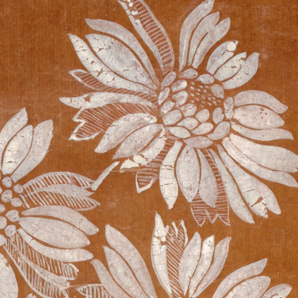 A closeup view of a textile pattern with a floral motif.